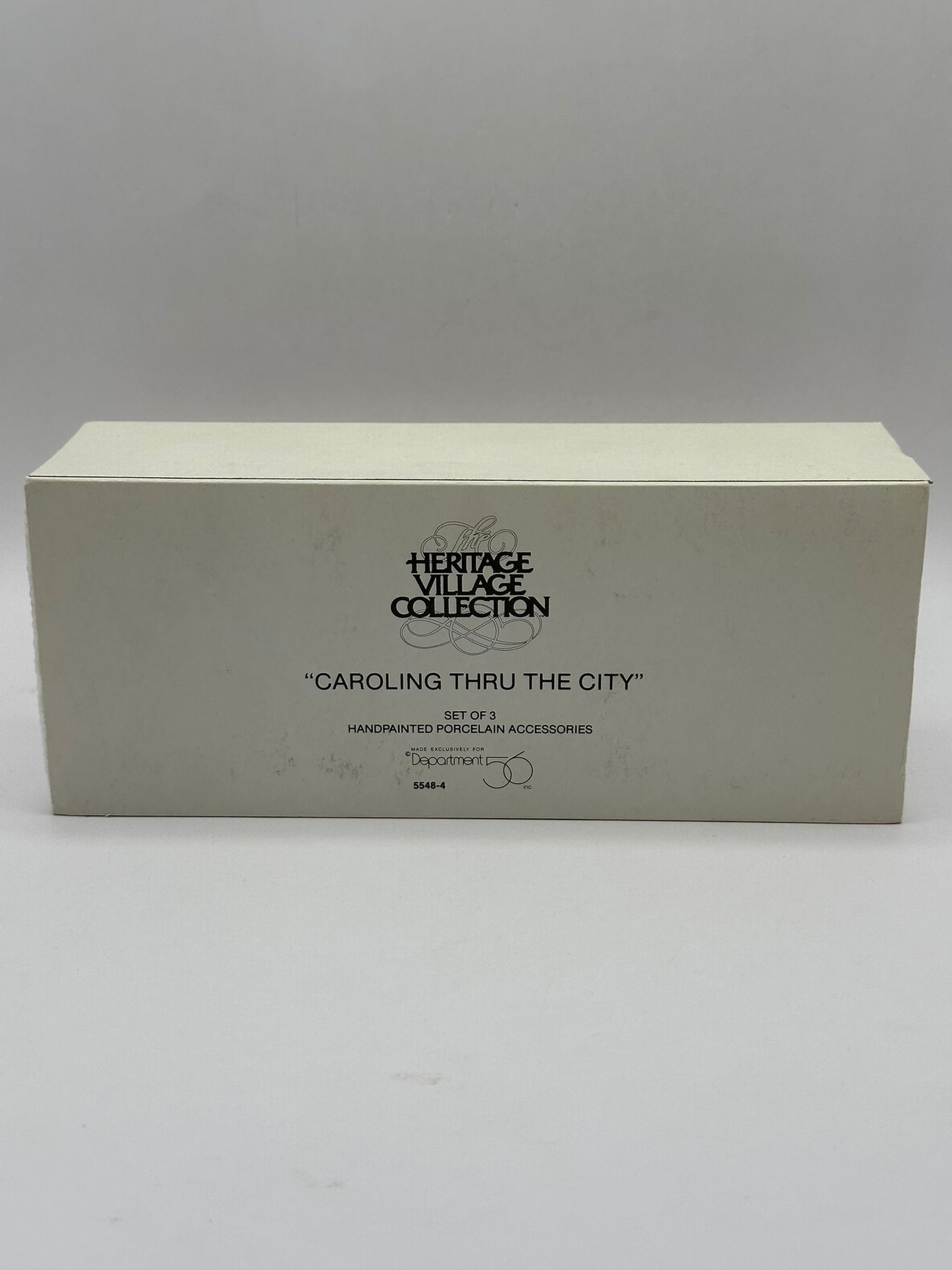 Department 56 - Caroling Thru The City - Christmas in the City